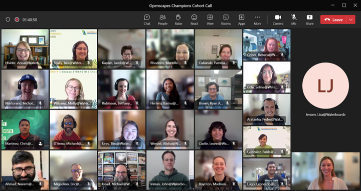 screenshot of 26 smiling participant faces in Google Meet grid view
